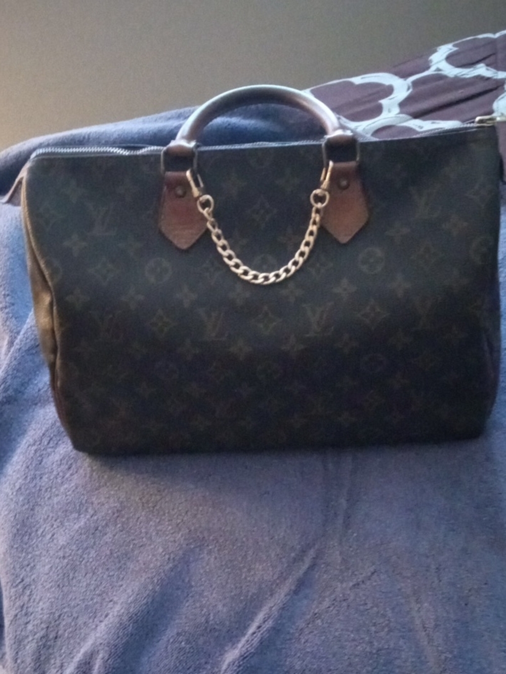 Luxury Monogram Canvas Top-Handle Louis Vuitton Bag in Brown.